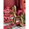 Figura de perrito de globo dorado