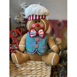 Galleta de jengibre sentada azul