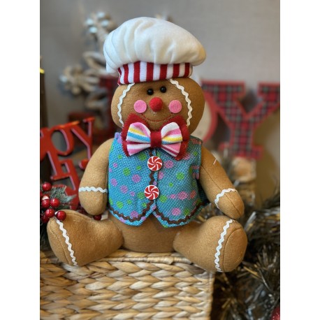 Galleta de jengibre sentada azul