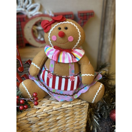 Galleta de jengibre sentada rosa
