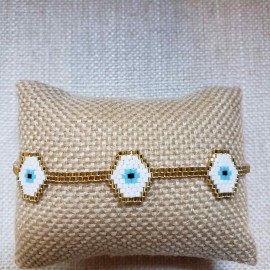 Pulsera 3 ojitos blanco con dorado