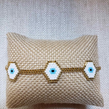 Pulsera 3 ojitos blanco con dorado