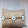 Pulsera 3 ojitos blanco con dorado